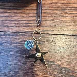 CHANEL Gold Star Keychain with Silver Flower Charm